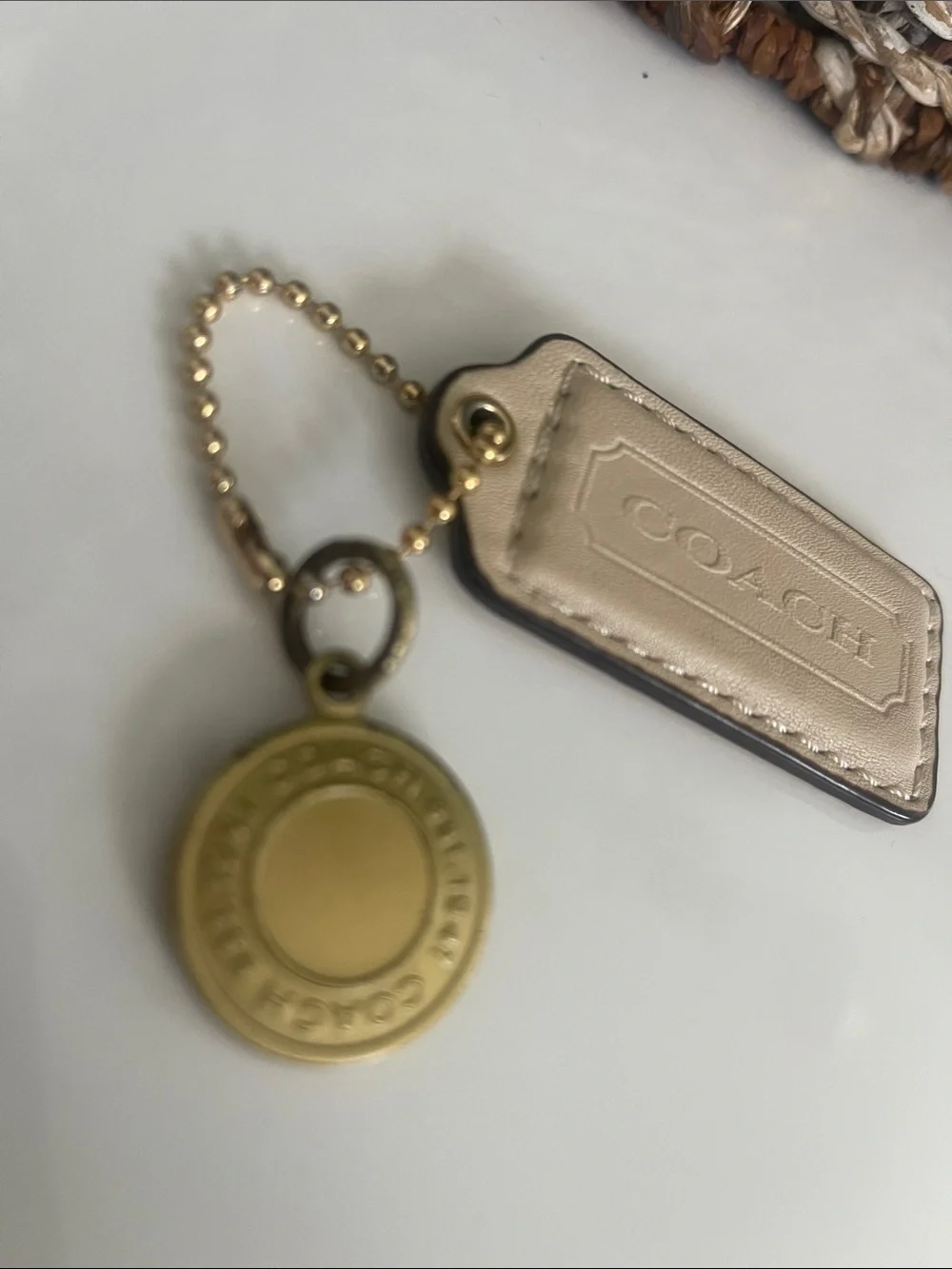 Coach Beige Leather Tag with Gold Medallion Charm  Some discoloration